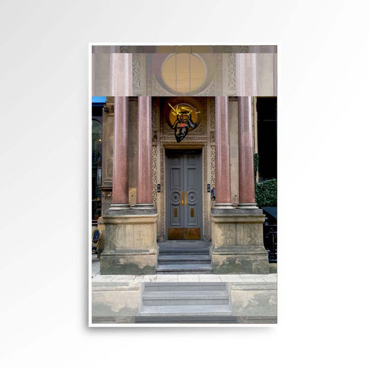 Photography print image of a door with a life like figure, on top of a circular window with four pillars next to it. Colours brown, maroon, grey, green.  Purpose, to be enjoyed, questioned and discussed.